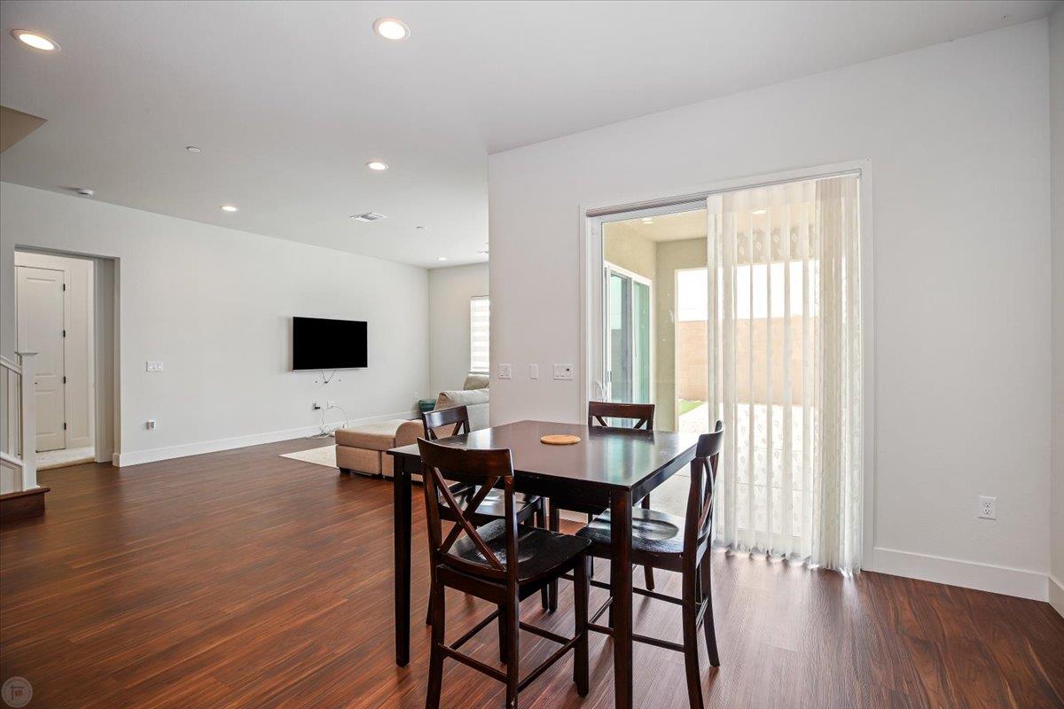 4205 Maddy Avenue Tracy, CA 95377 - Photo 11 of 45 a view of a dining room with furniture and wooden floor