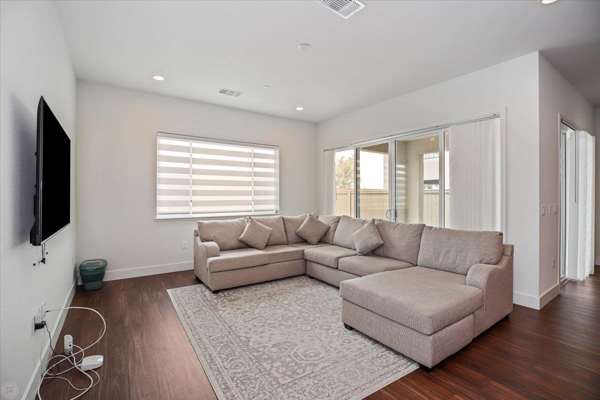 4205 Maddy Avenue Tracy, CA 95377 - Photo 13 of 45 a living room with furniture and a flat screen tv