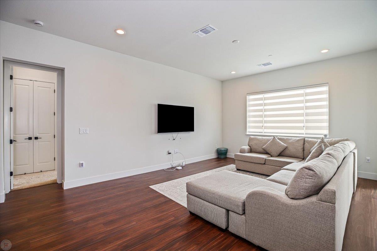 4205 Maddy Avenue Tracy, CA 95377 - Photo 16 of 45 a living room with furniture and a flat screen tv
