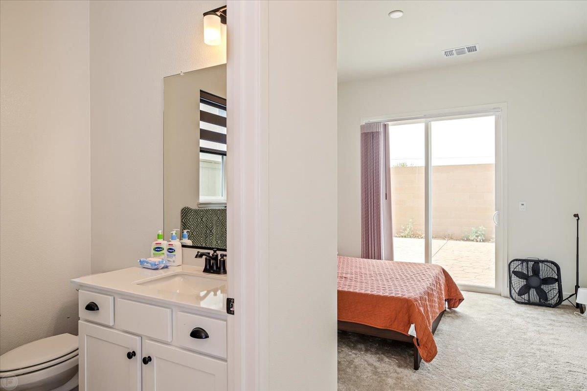 4205 Maddy Avenue Tracy, CA 95377 - Photo 17 of 45 a en suite bathroom with a double vanity sink