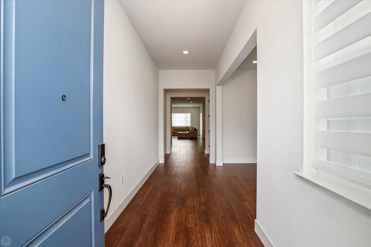 4205 Maddy Avenue Tracy, CA 95377 - Photo 2 of 45 a view of a hallway with wooden floor and staircase