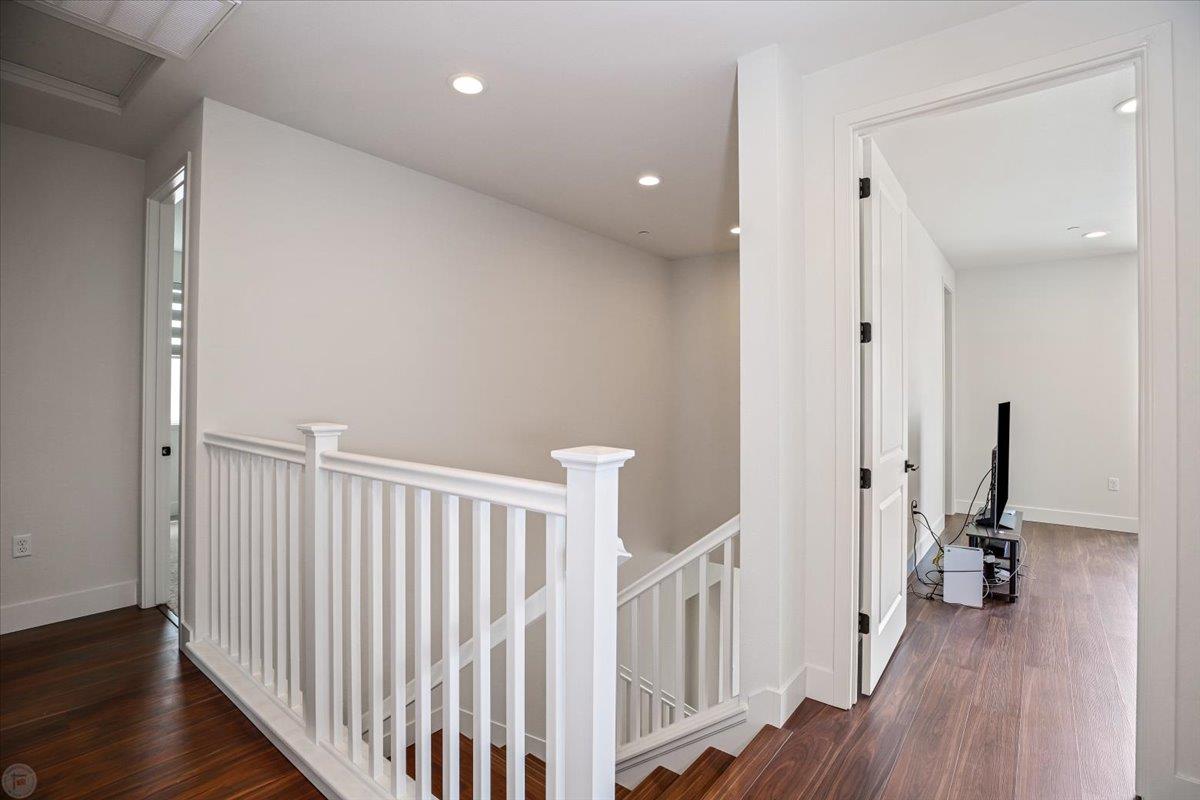 4205 Maddy Avenue Tracy, CA 95377 - Photo 21 of 45 a view of a hallway with a hallway and a wooden floor