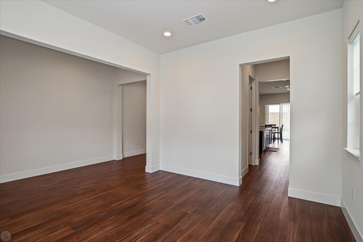 4205 Maddy Avenue Tracy, CA 95377 - Photo 5 of 45 a view of a hallway with wooden floor