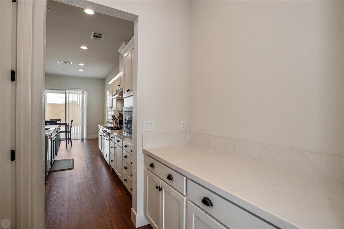 4205 Maddy Avenue Tracy, CA 95377 - Photo 6 of 45 a view of a hallway with wooden floor and staircase