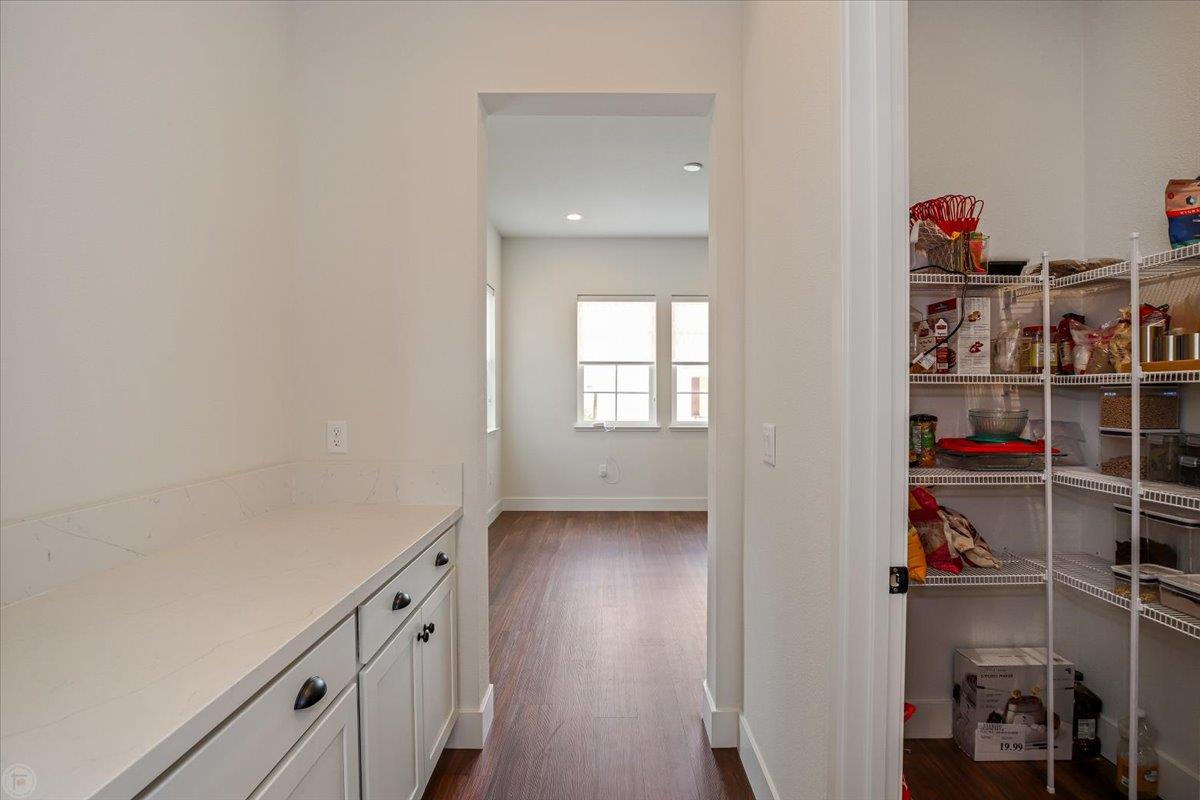 4205 Maddy Avenue Tracy, CA 95377 - Photo 7 of 45 a view of walk in closet with clothes and shoes