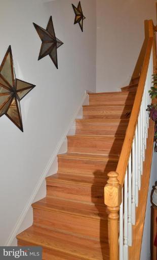 1244 Woodbrook Court Reston, VA 20194 - Photo 14 of 30 Elegant Staircase to upper level with wood stairs