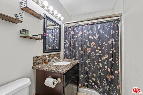 a bed room with a bed and a window