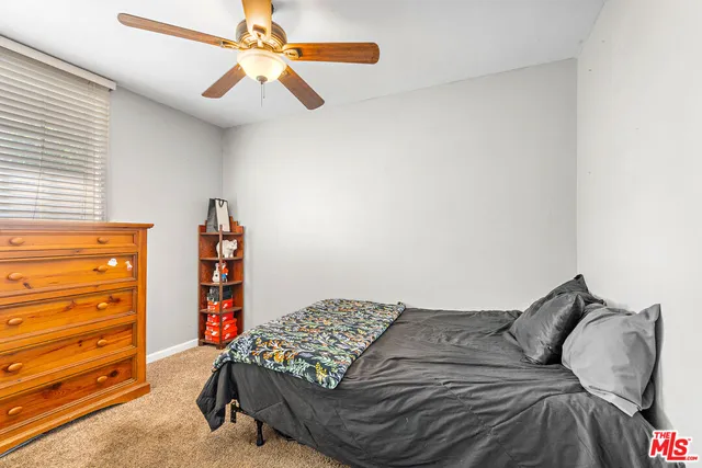 a bedroom with a bed and walk in closet