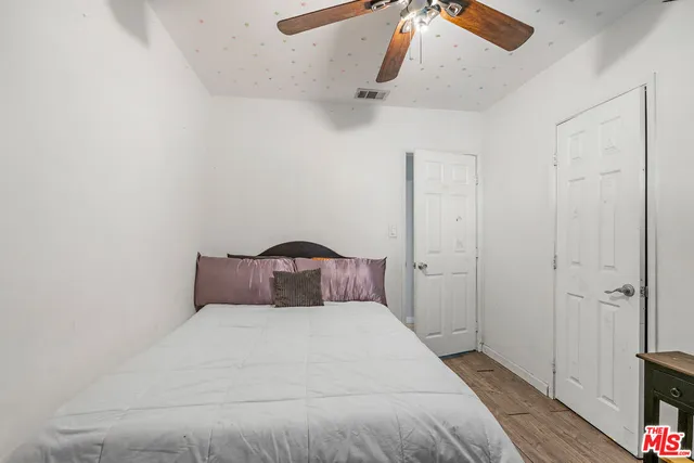 a view of a house with a yard patio and swimming pool
