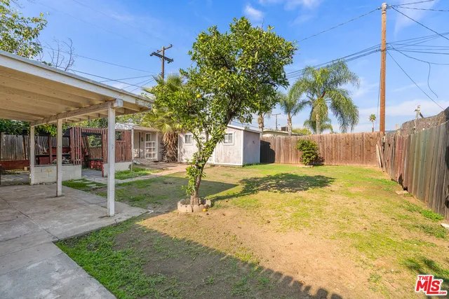 a view of a house with a yard and garage