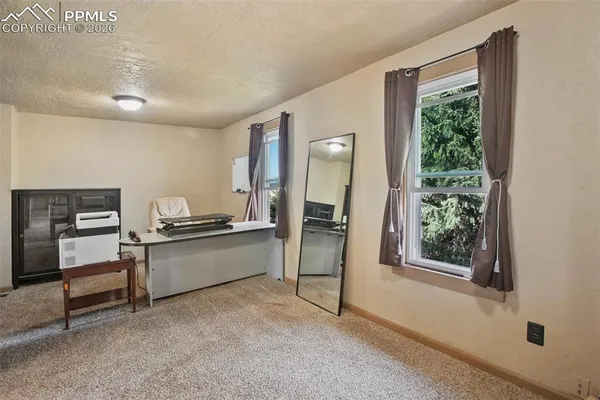 a view of a golf course with a lake