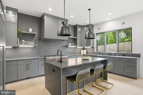 a spacious bathroom with a granite countertop sink and a mirror