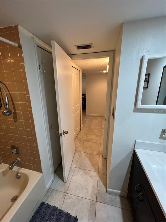 7110 Cognac Drive, Unit 2 New Port Richey, FL 34653 - Photo 13 of 24 a bathroom with a sink a toilet and shower