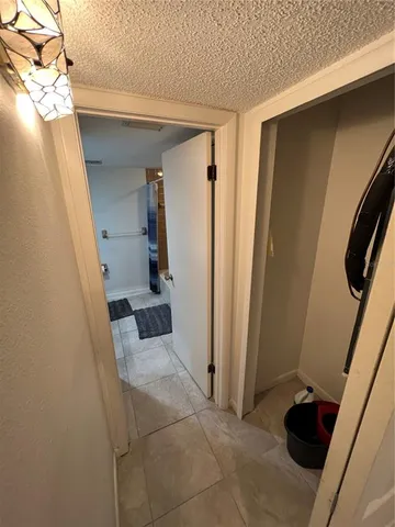 a view of entryway and kitchen