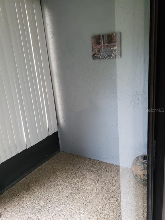 7110 Cognac Drive, Unit 2 New Port Richey, FL 34653 - Photo 20 of 24 a view of a hallway