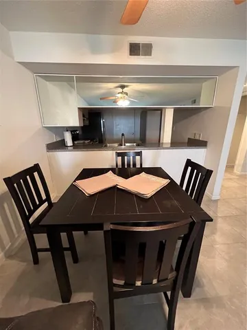 a view of table and chairs in kitchen