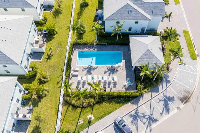 an aerial view of a house with a swimming pool