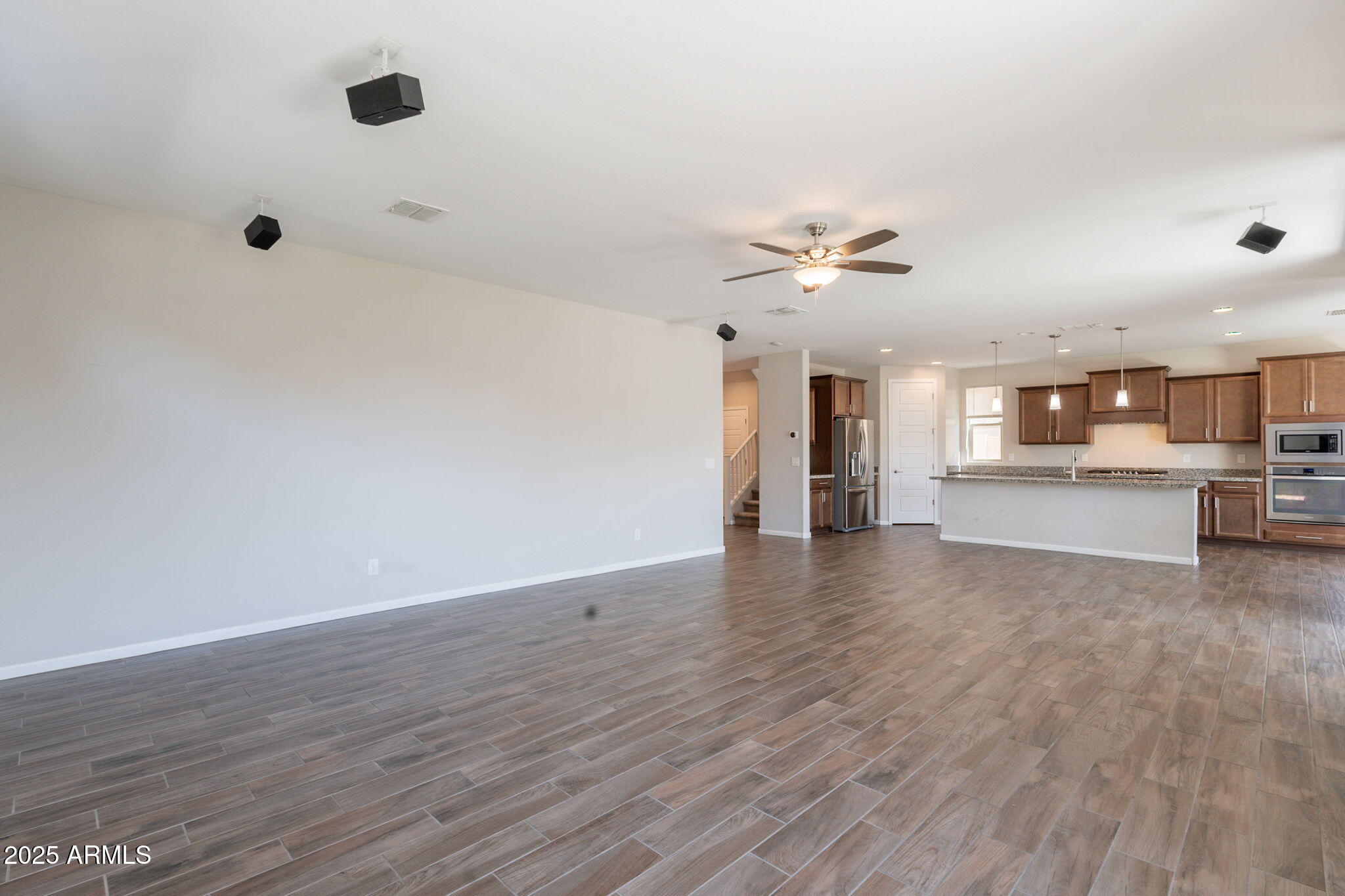 98 North Bay Drive Gilbert, AZ 85233 - Photo 11 of 37 a view of an empty room with a kitchen