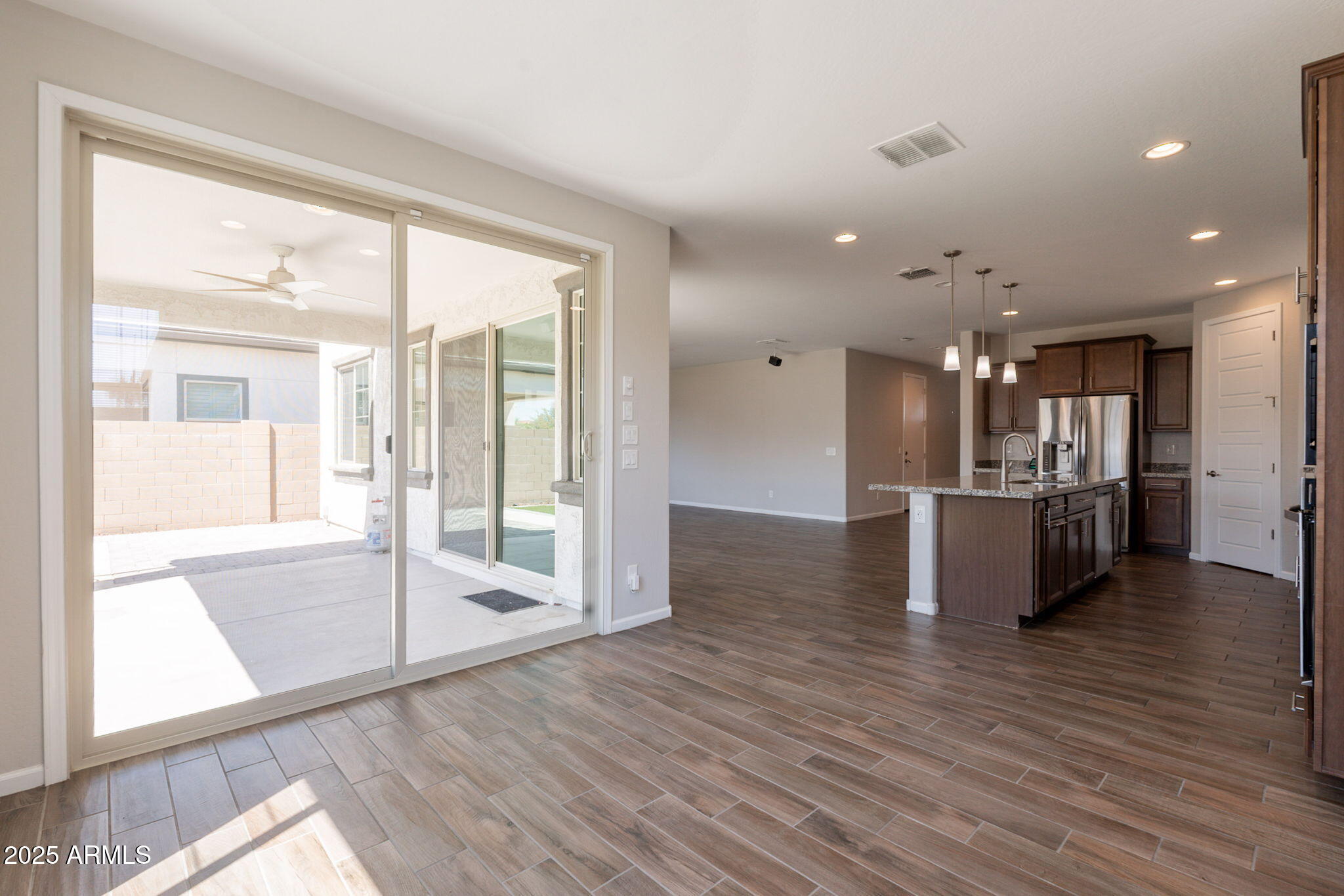 98 North Bay Drive Gilbert, AZ 85233 - Photo 13 of 37 a view of a large kitchen with a large window and wooden floor