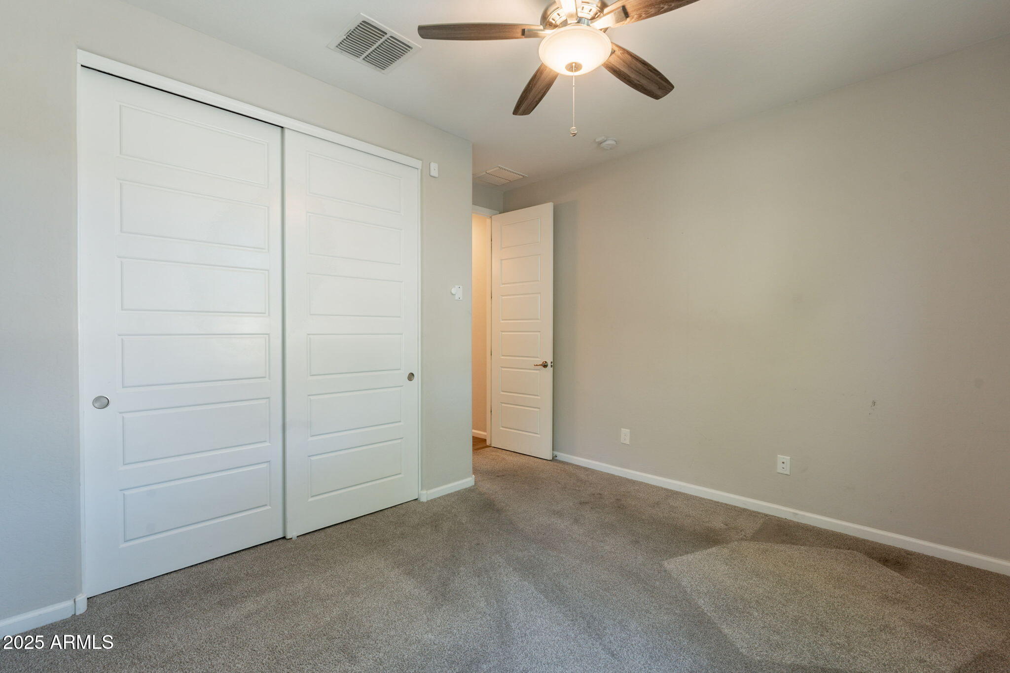98 North Bay Drive Gilbert, AZ 85233 - Photo 17 of 37 an empty room with a chandelier fan