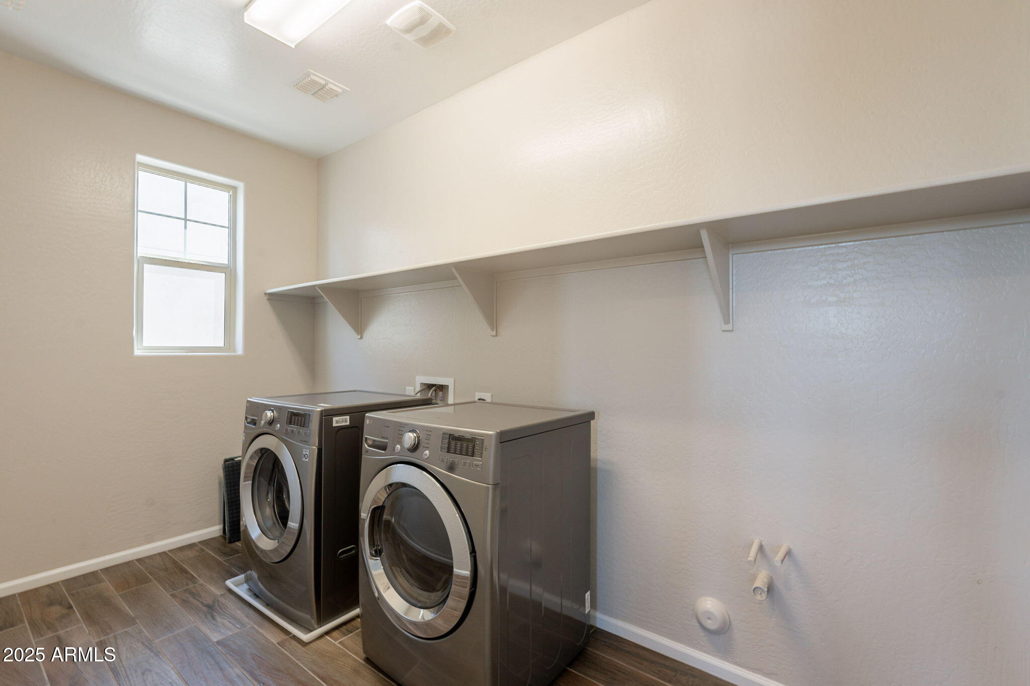 98 North Bay Drive Gilbert, AZ 85233 - Photo 21 of 37 a utility room with dryer and washer