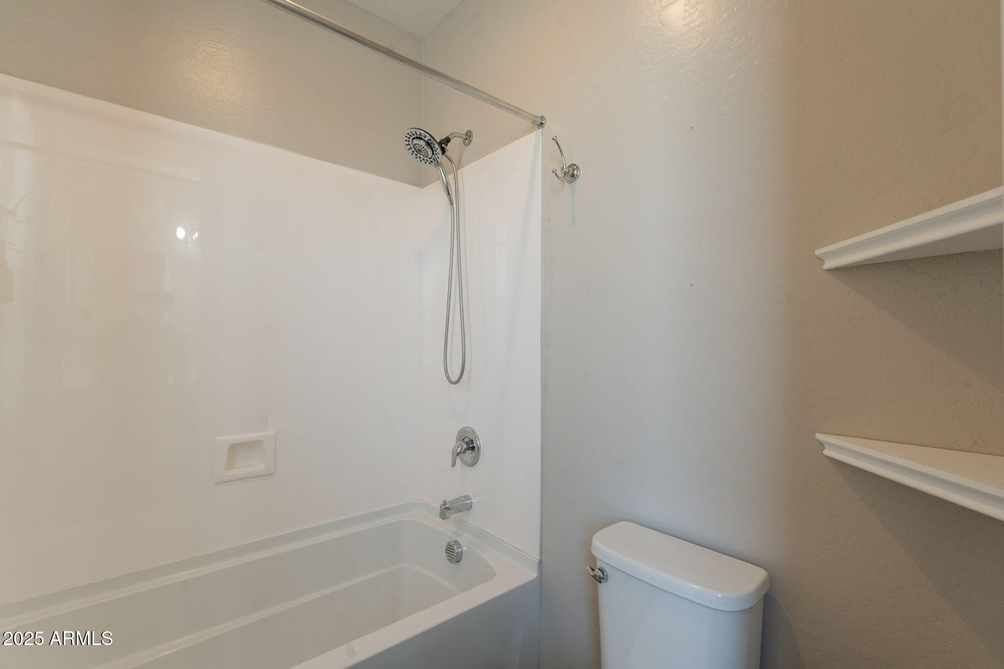 98 North Bay Drive Gilbert, AZ 85233 - Photo 29 of 37 a bathroom with a bathtub and a toilet