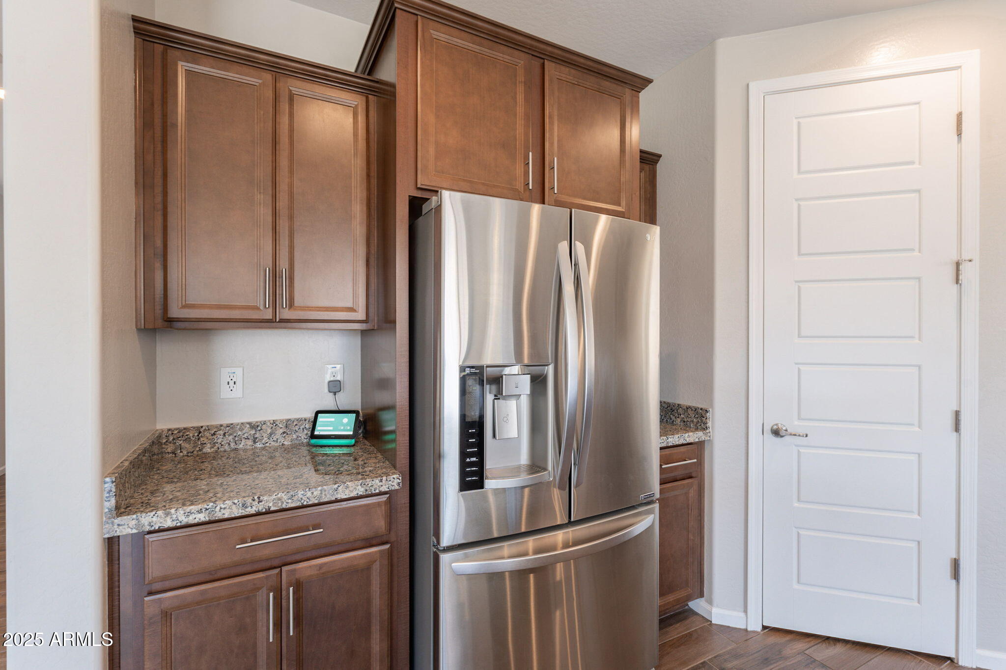 98 North Bay Drive Gilbert, AZ 85233 - Photo 5 of 37 a kitchen with stainless steel appliances granite countertop a refrigerator and a sink