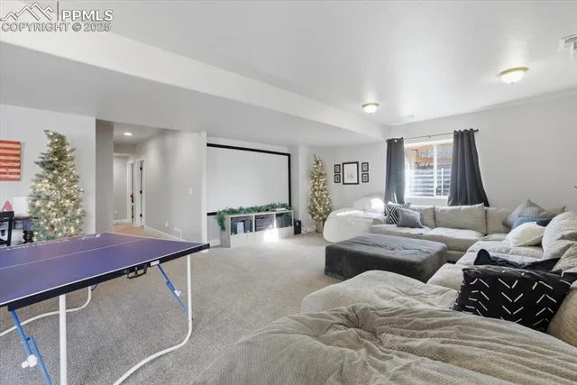 a bedroom with furniture and a potted plant