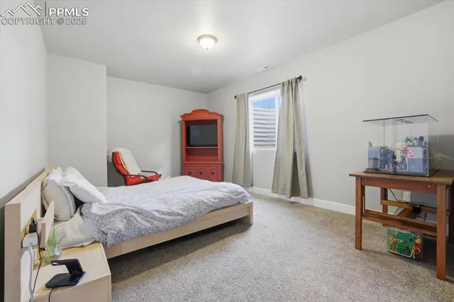 a bedroom with a bed and a cabinets