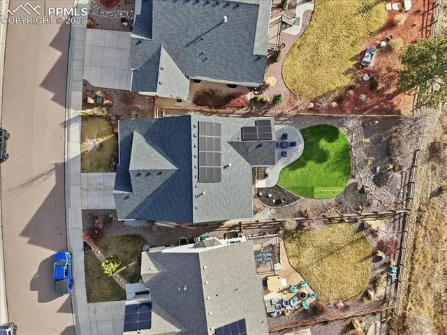 an aerial view of residential houses with outdoor space