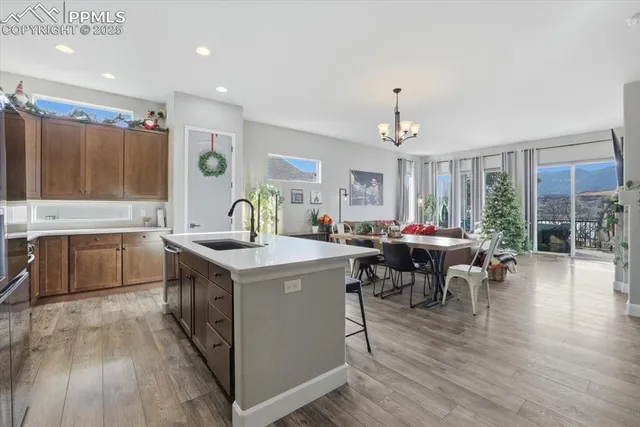 a kitchen that has a lot of cabinets a sink and a stove in it