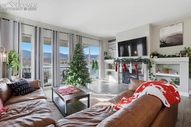 a living room with furniture and a flat screen tv