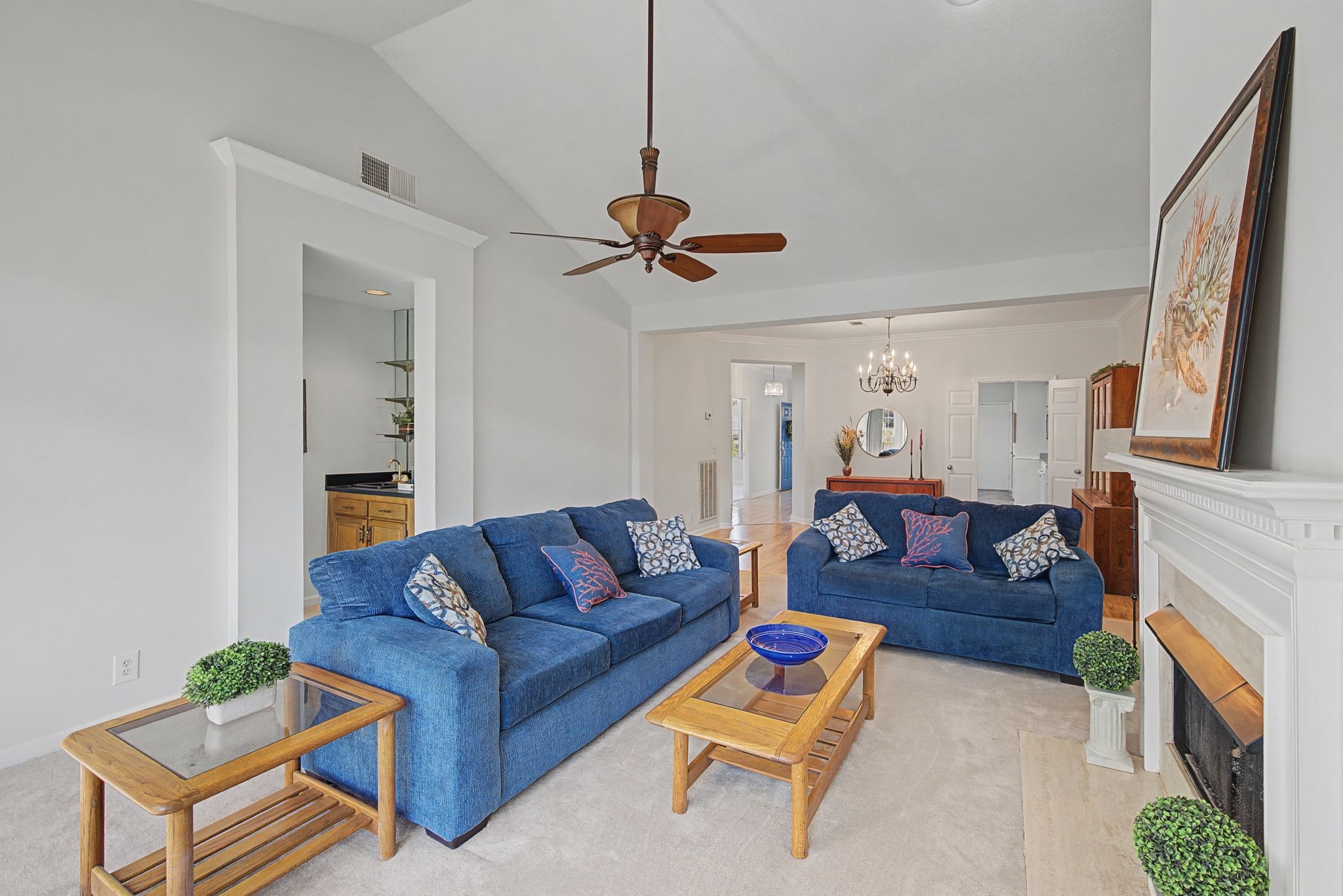 231 Green Harbor Road, Unit 8 Old Hickory, TN 37138 - Photo 19 of 36 a living room with furniture a fireplace and a chandelier