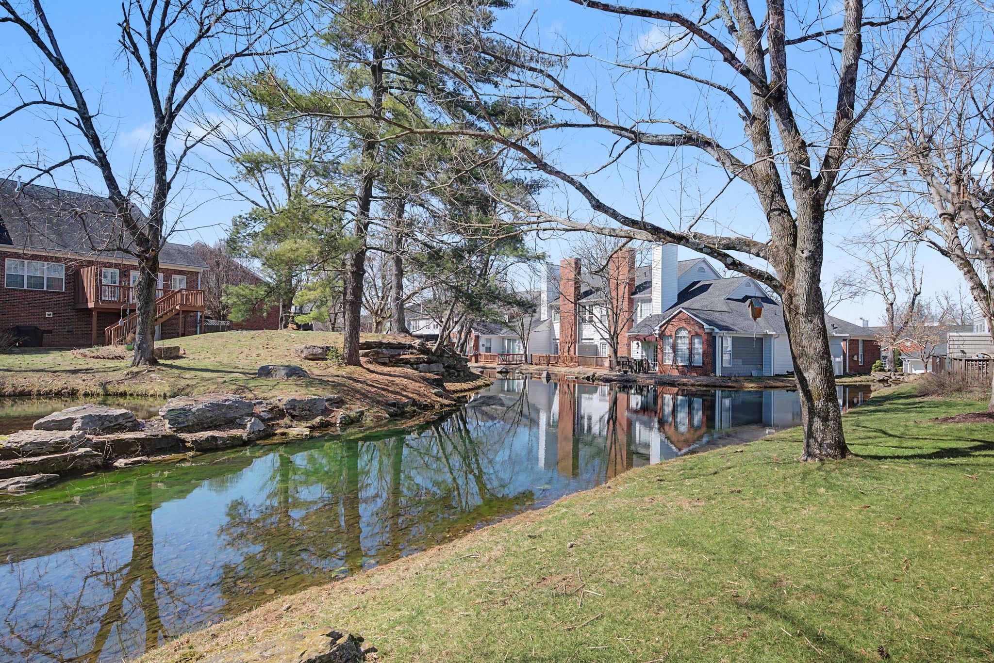 231 Green Harbor Road, Unit 8 Old Hickory, TN 37138 - Photo 28 of 36 a backyard of a house with barbeque oven and outdoor seating