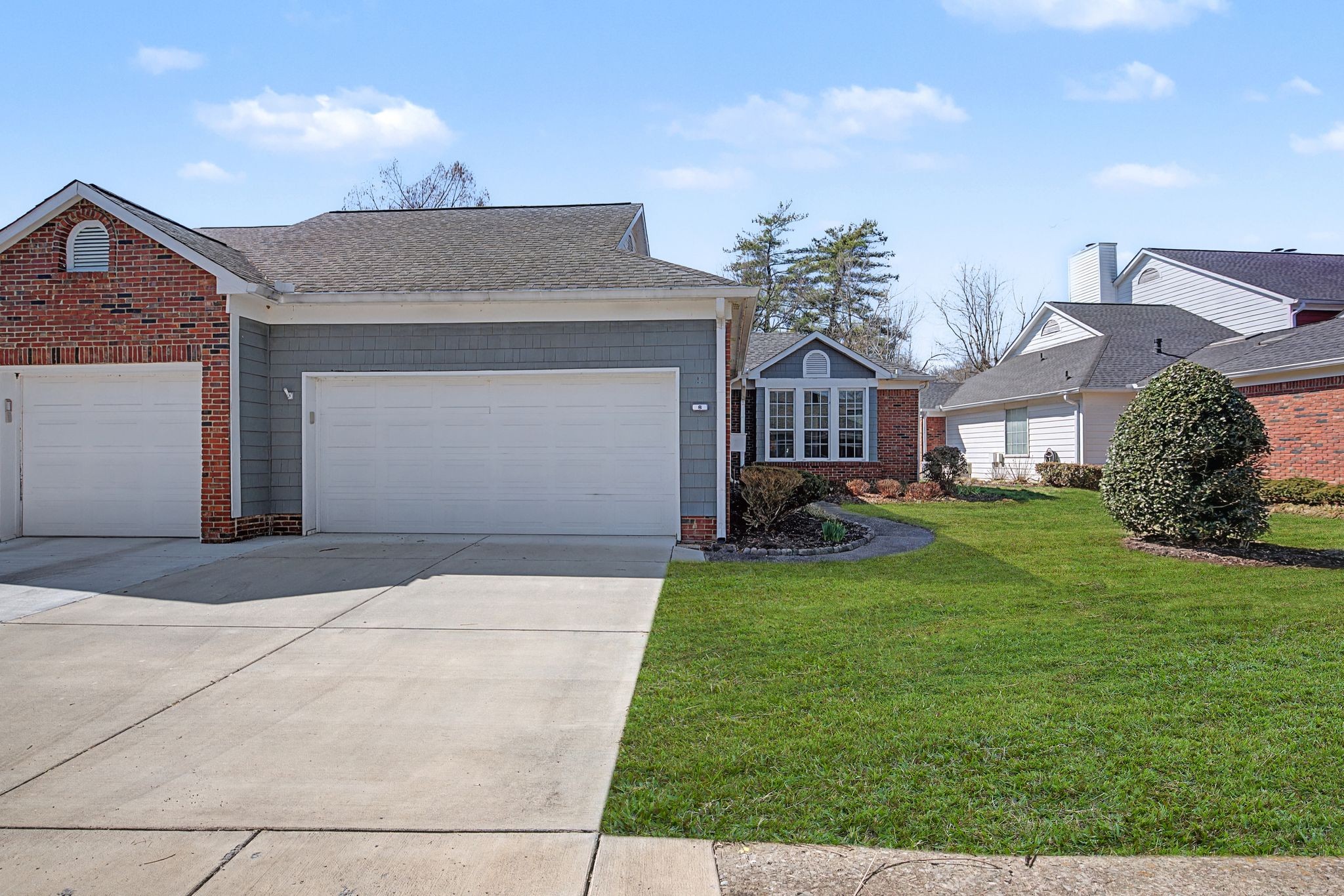 231 Green Harbor Road, Unit 8 Old Hickory, TN 37138 - Photo 7 of 36 a front view of a house with a garden and plants