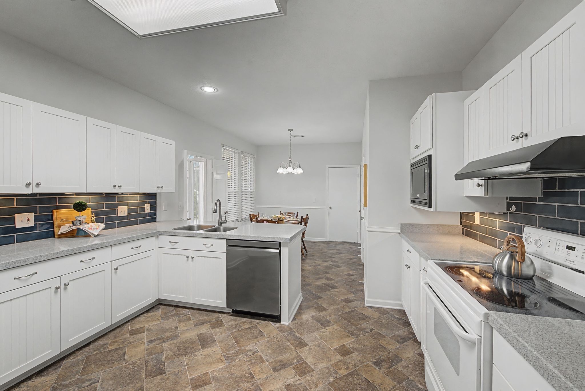 231 Green Harbor Road, Unit 8 Old Hickory, TN 37138 - Photo 9 of 36 a kitchen with a sink stove top oven and cabinets