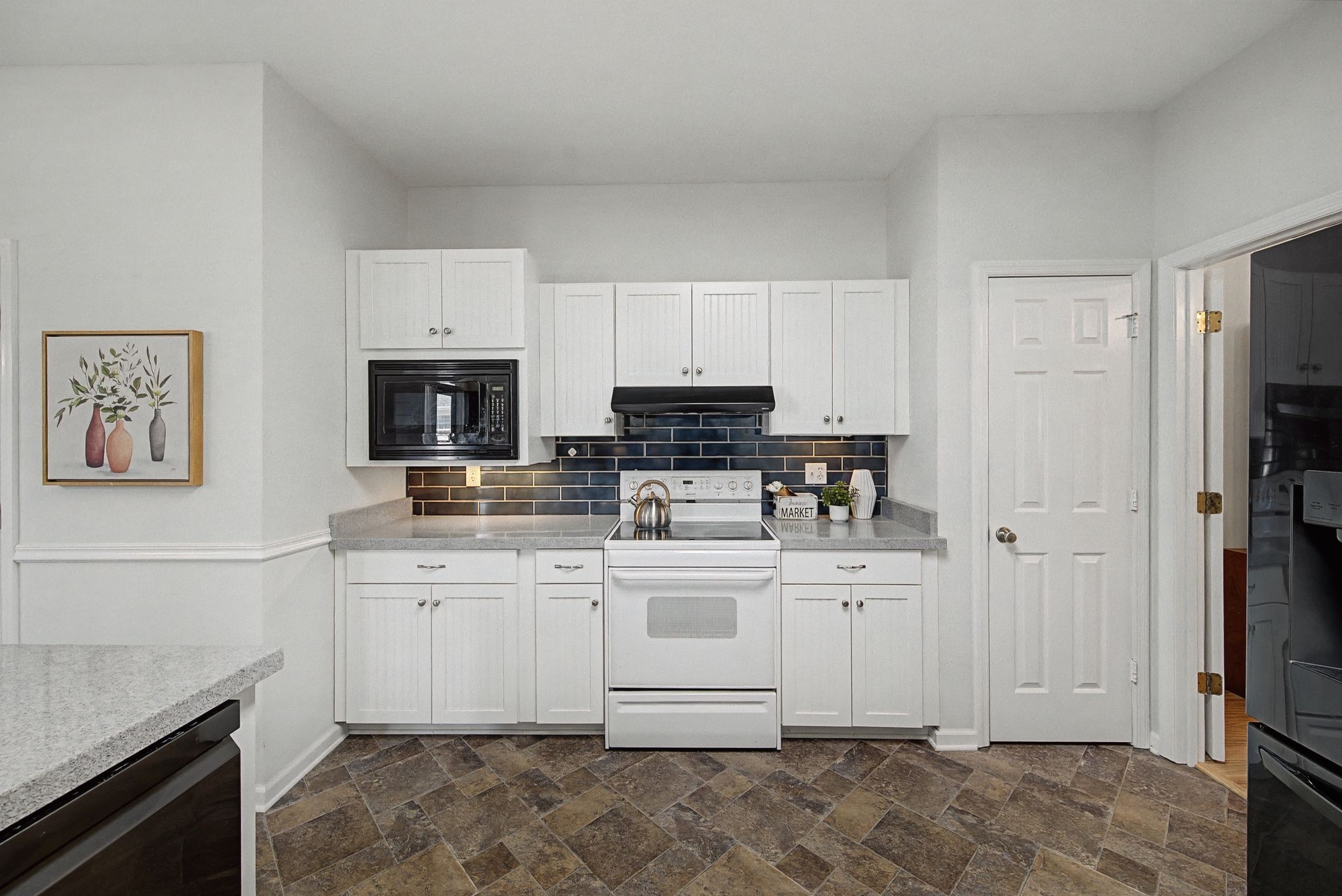 231 Green Harbor Road, Unit 8 Old Hickory, TN 37138 - Photo 10 of 36 a kitchen with stainless steel appliances granite countertop a stove a sink and a refrigerator