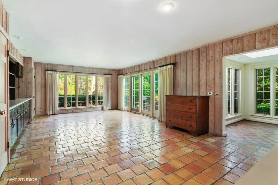 285 Old Farm Road Northfield, IL 60093 - Photo 9 of 21 a large room with a large window and wooden floor