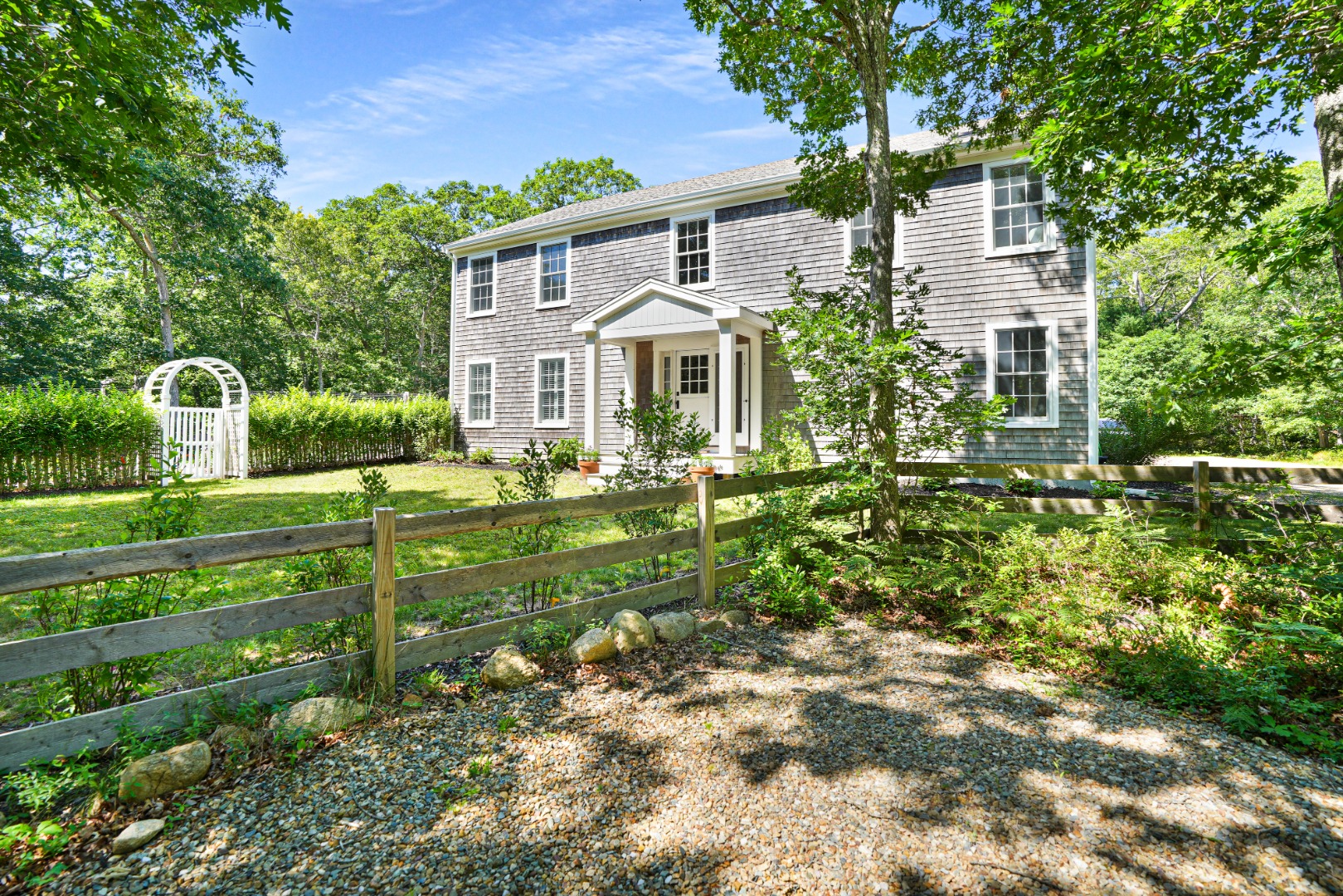 53 Stoney Hill Road West Tisbury, MA 02568 - Photo 1 of 51 a front view of a house with a garden