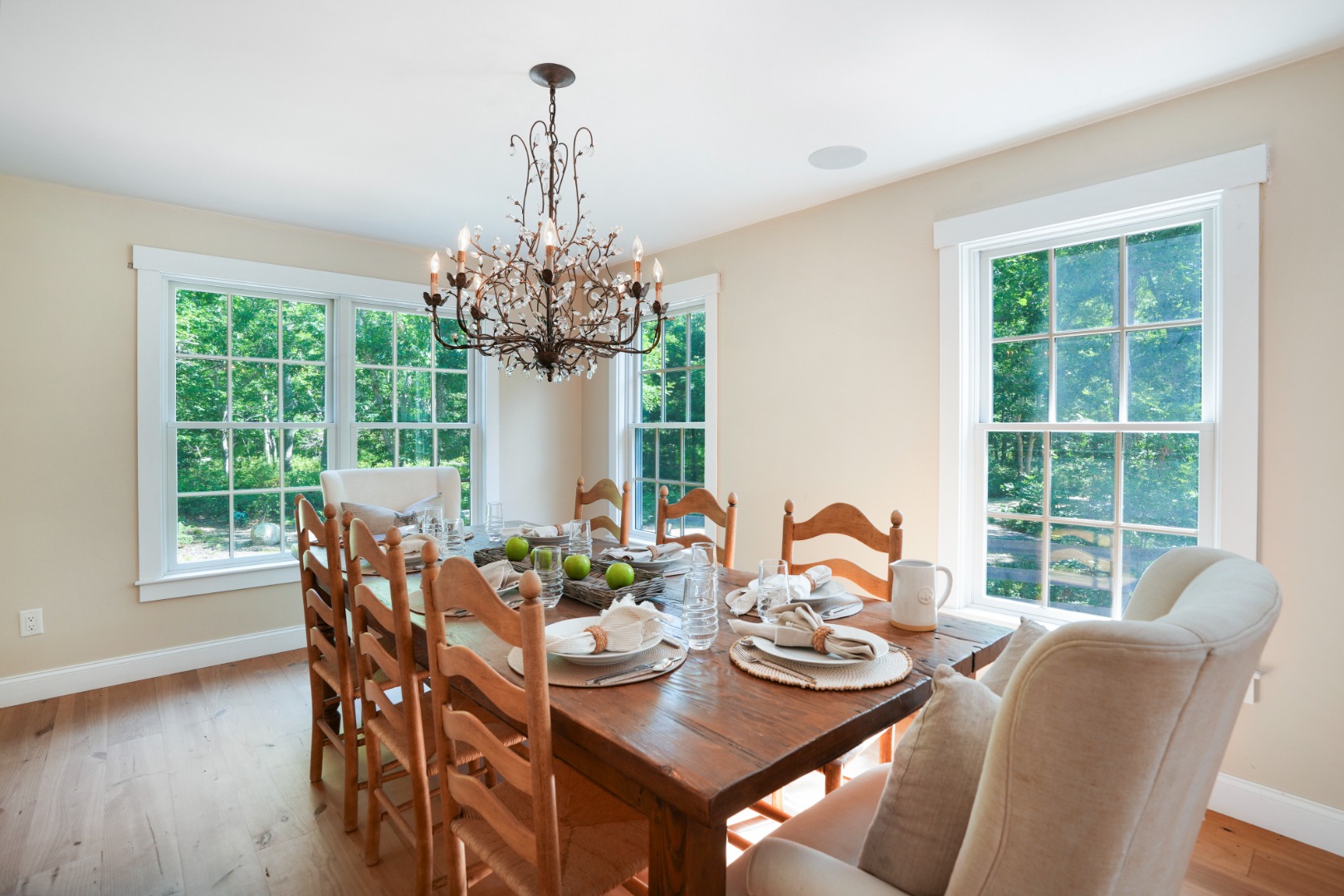 53 Stoney Hill Road West Tisbury, MA 02568 - Photo 11 of 51 a dining room with furniture a chandelier and wooden floor