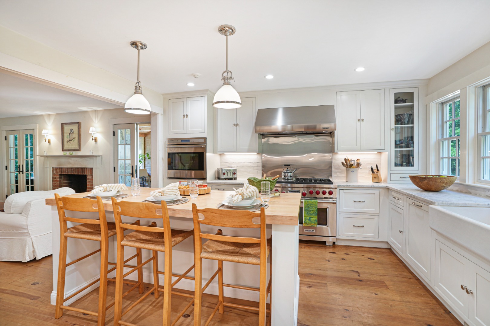 53 Stoney Hill Road West Tisbury, MA 02568 - Photo 13 of 51 a kitchen with stainless steel appliances kitchen island granite countertop a table chairs and a refrigerator