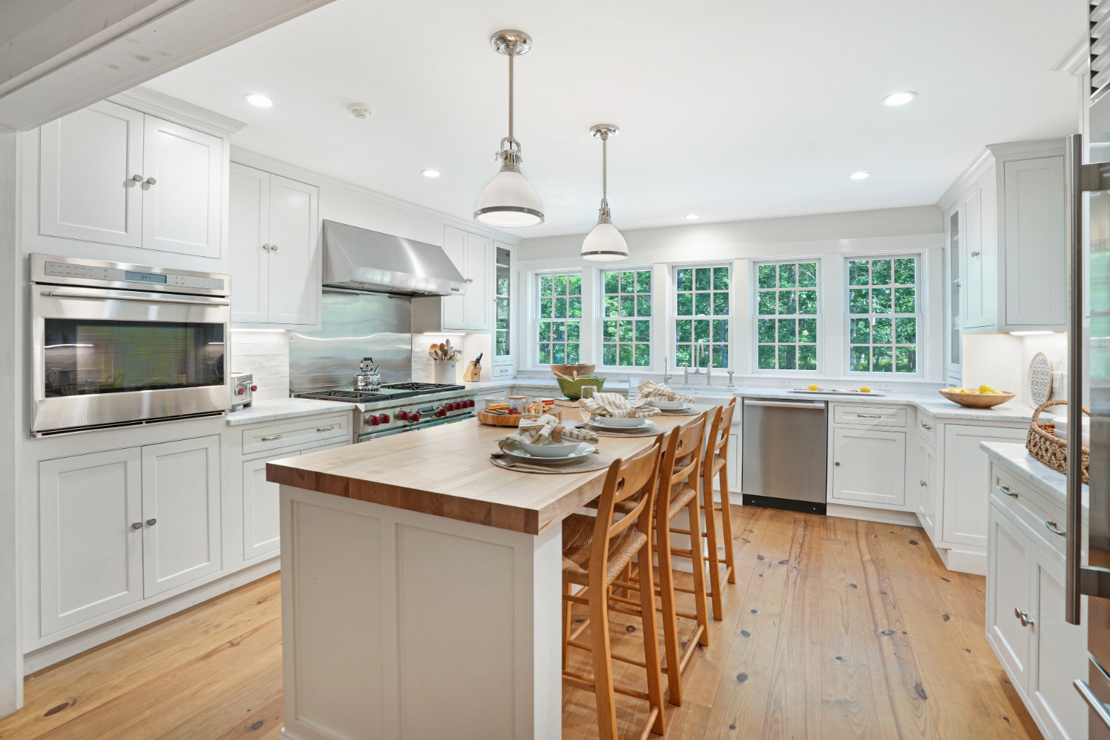 53 Stoney Hill Road West Tisbury, MA 02568 - Photo 14 of 51 a kitchen with stainless steel appliances kitchen island a large window a sink and cabinets