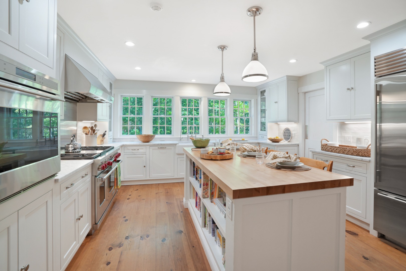 53 Stoney Hill Road West Tisbury, MA 02568 - Photo 15 of 51 a kitchen with kitchen island a counter space a sink appliances and a large window