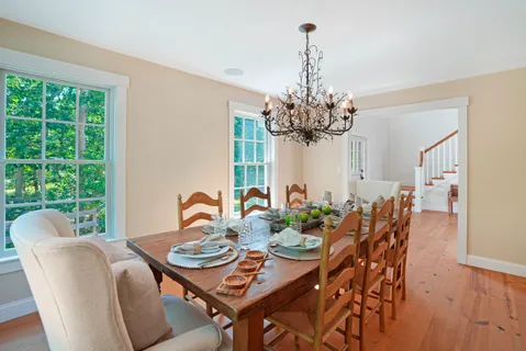a view of a dining room with furniture window and outside view