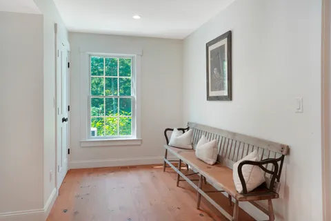 a view of a room with windows and lounge chair