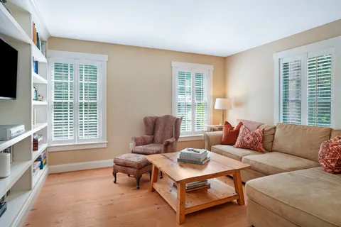 a living room with furniture and windows