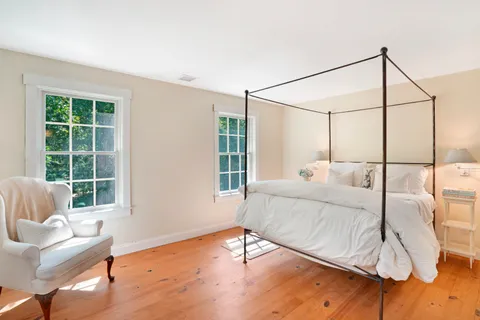 a bed room with a bed and a couch
