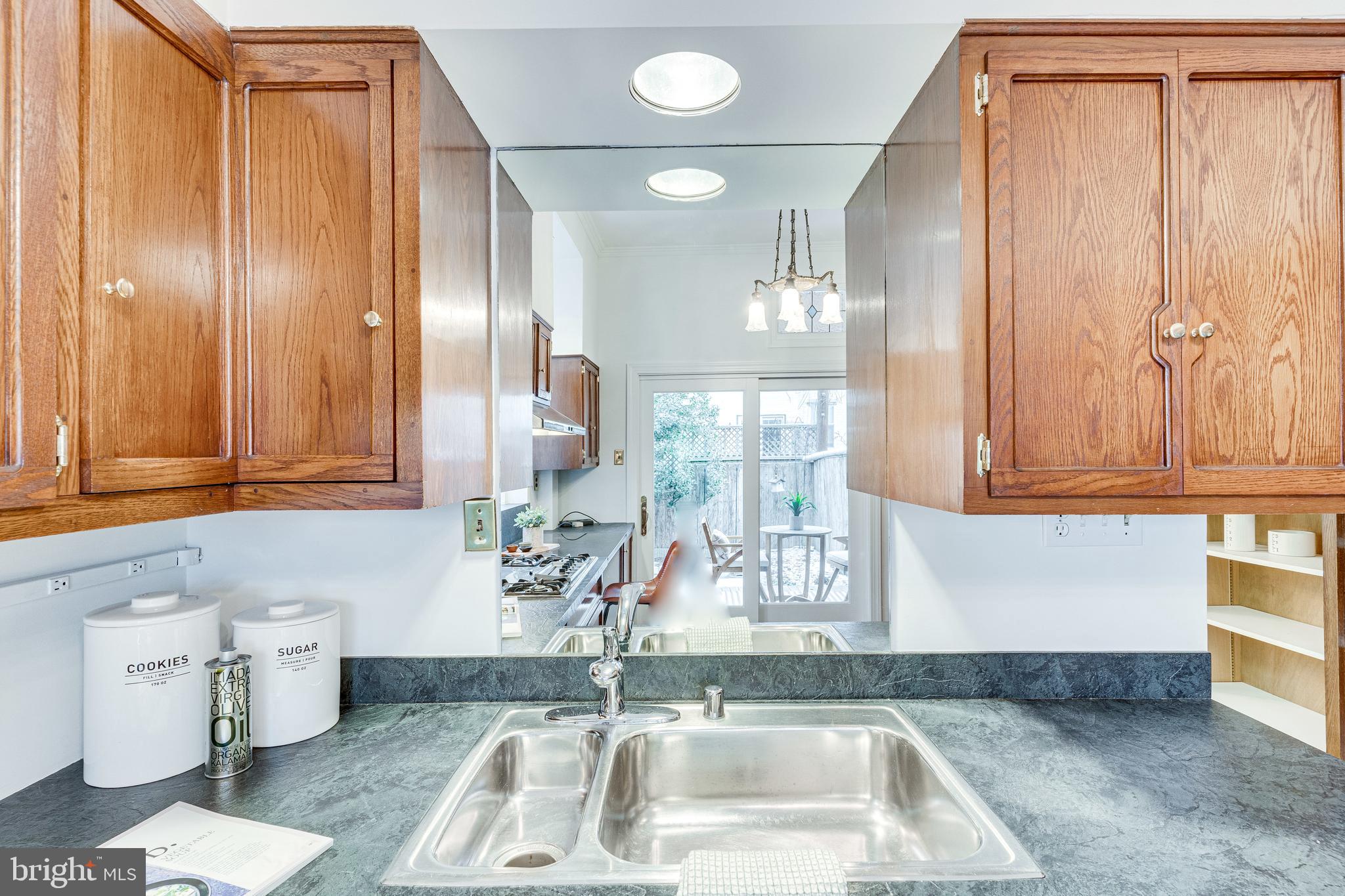 148 F Street Southeast Washington, DC 20003 - Photo 21 of 72 Backyard+patio +historic light reflected in mirror