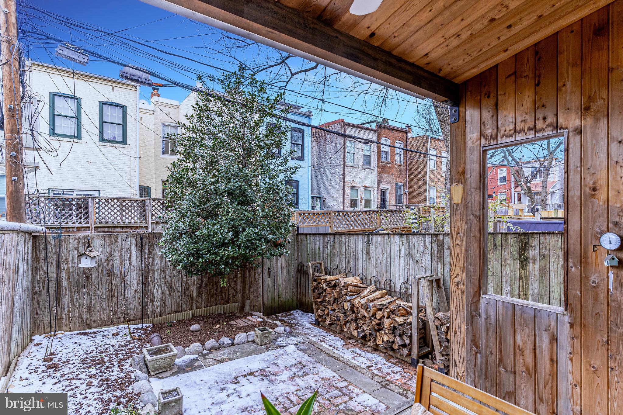 148 F Street Southeast Washington, DC 20003 - Photo 47 of 72 Covered porch looks onto patio + large plant beds
