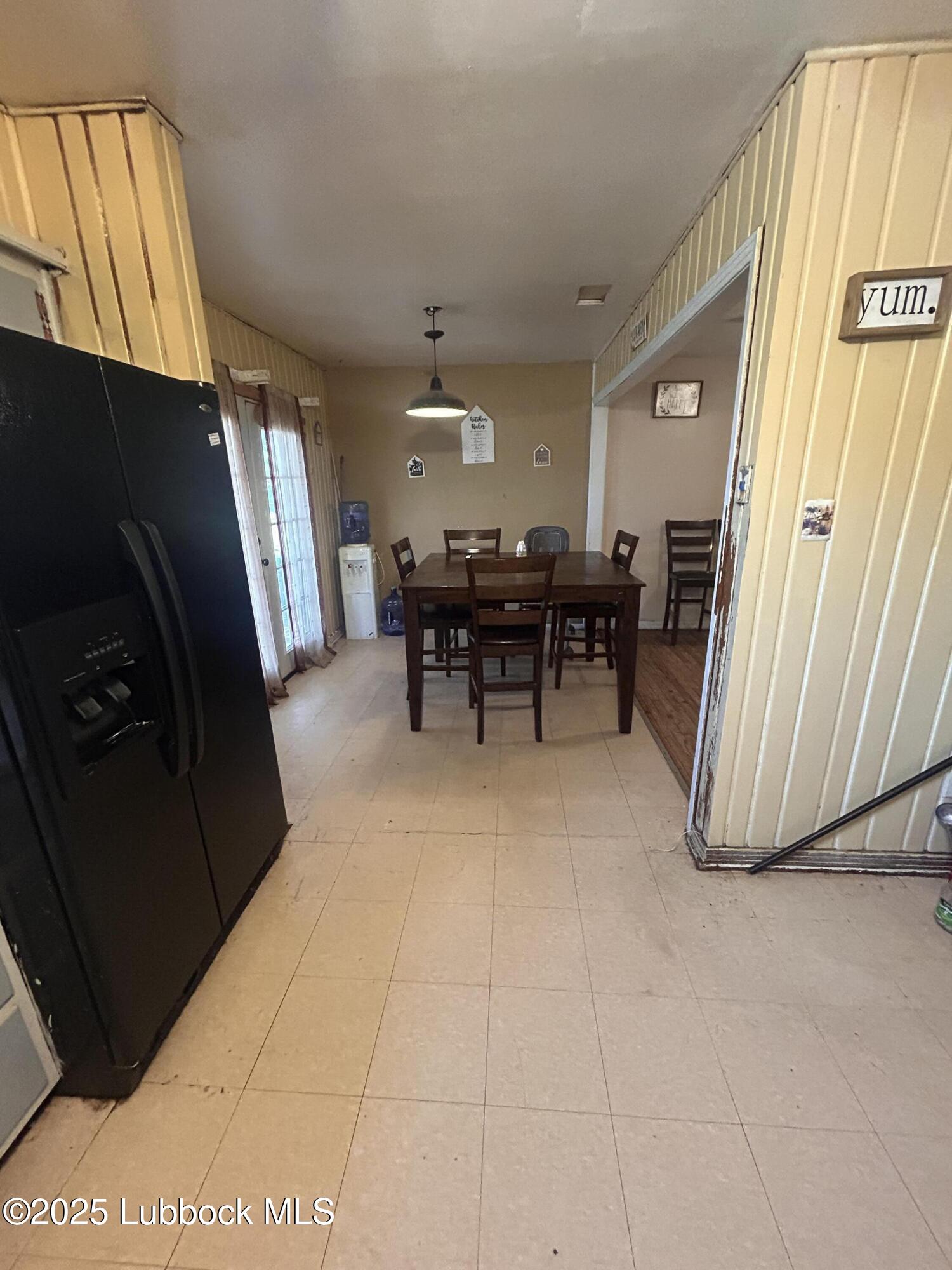 2712 37th Street Lubbock, TX 79413 - Photo 5 of 12 a view of a dining room with furniture window and outside view